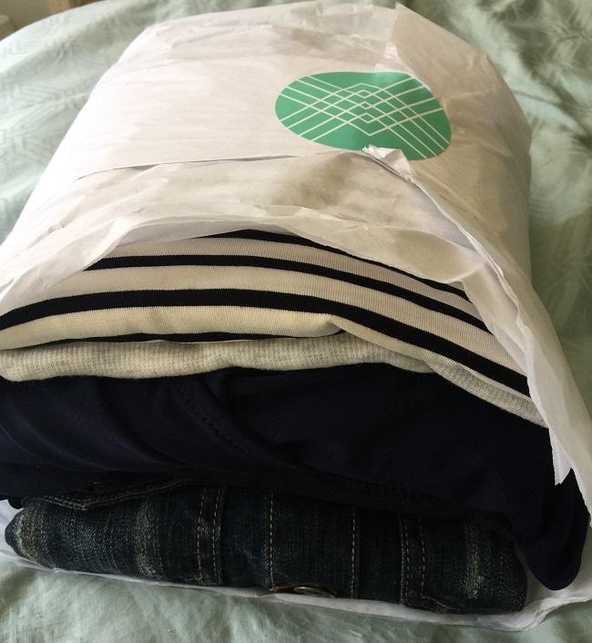 My bundle of Stitch Fix items, fresh out of the box and all wrapped up in tissue paper.